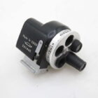 A vintage camera viewfinder labeled 'Made in USSR' with rotating lens dials and a metallic attachment on a white background.