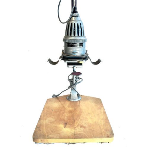 Vintage Opemus photo enlarger on a wooden base with metal components and wiring visible.