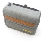 A grey fabric pouch with a brown leather accent and a zipper on top, featuring the brand name 'Nisi' in yellow letters on the front.