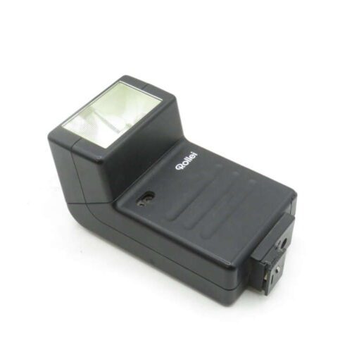 A black Rollei camera flash unit with a rectangular flash head and a hot shoe mount, angled on a white background.