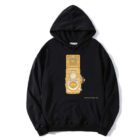 Black hoodie featuring a yellow graphic of a vintage camera on the front.