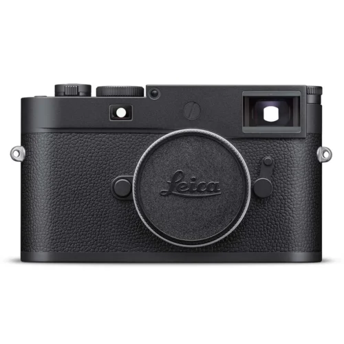 A black Leica camera with a textured body, featuring a circular lens cap and viewfinder on the top right.