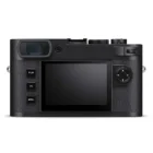 Back view of a black Leica digital camera with a display screen, three buttons labeled Play, FN, and Menu, and a control dial on the right side.
