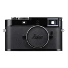 A black Leica camera with a textured body, featuring a prominent lens mount cap displaying the Leica logo.