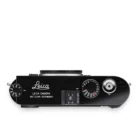 Top view of a black Leica M11 camera showing the shutter speed dial, ISO dial, and engraved text reading 'Leica Camera Wetzlar Germany'.
