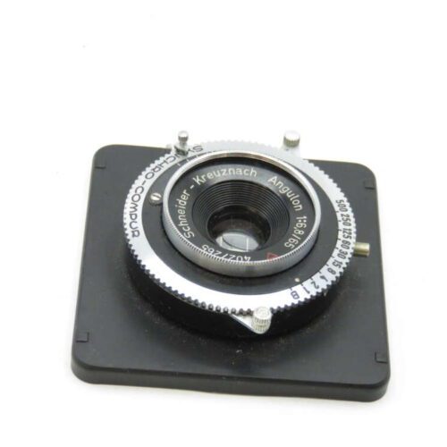 A Schneider-Kreuznach Angulon f/6.8 65mm camera lens mounted on a lens board with visible aperture and shutter settings.
