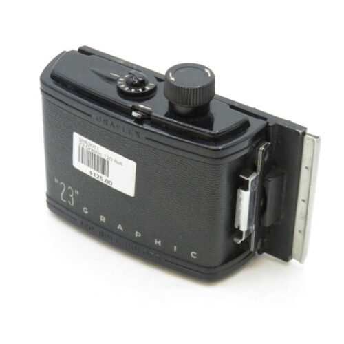A vintage Graflex "23" Graphic roll film holder designed for 120 film with a price tag of $125, displaying a black exterior with intricate mechanical details.