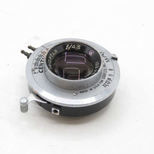 A vintage camera lens with markings including "CENT" and "f/4.5" engraved on the metal rim, featuring a glass element and a small silver thumb screw on the side.