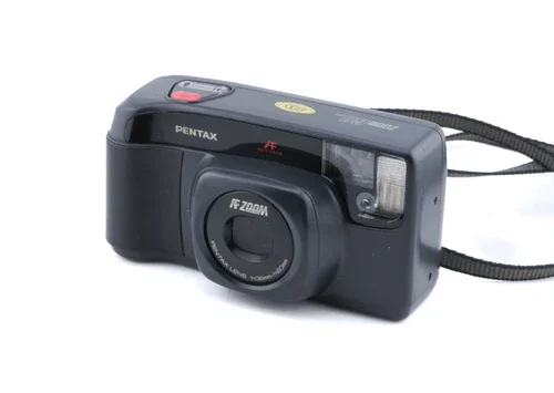 A black Pentax FF Zoom 35mm film camera with a wrist strap attached.