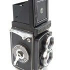 A vintage Yashica Mat twin-lens reflex camera in black with chrome details, angled to show the focusing knobs and viewfinder.