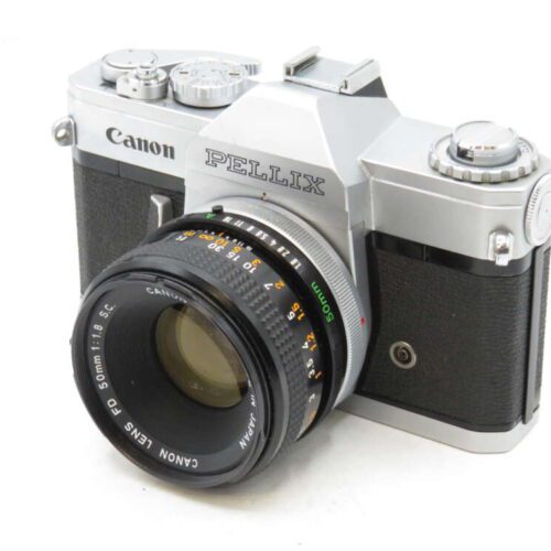 A vintage Canon Pellix film camera with a 50mm lens and multiple dials on the top.