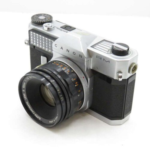A vintage Canon RM film camera with a silver and black body and a prominent lens.