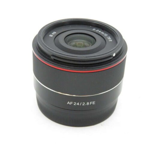 A black camera lens with a red ring, labelled "AF 24/2.8 FE".
