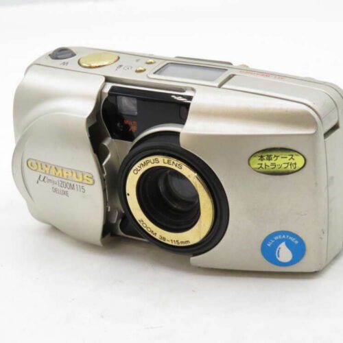 A silver Olympus µ[mju:]-II 80mm film camera with a protective lens cover and visible controls on top.