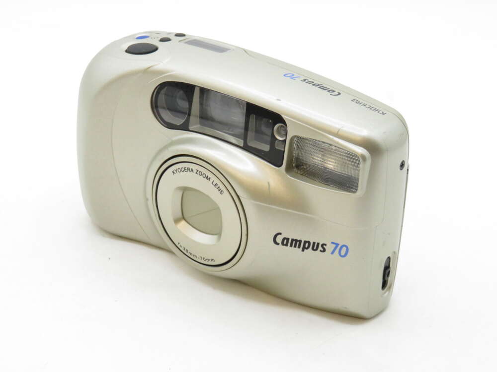 IMG_3233 Silver Kyocera Campus 70 film camera with zoom lens and built-in flash.