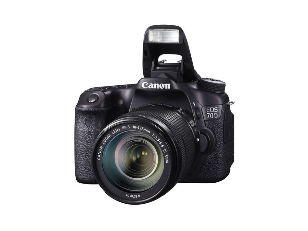 Canon EOS 70D DSLR camera with a raised flash and an 18-135mm lens.