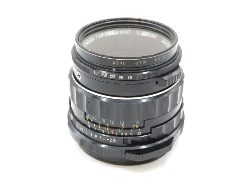 IMG_3319 A vintage Takumar 6x7 camera lens with focus and aperture rings, markings range from f/2.8 to f/32.