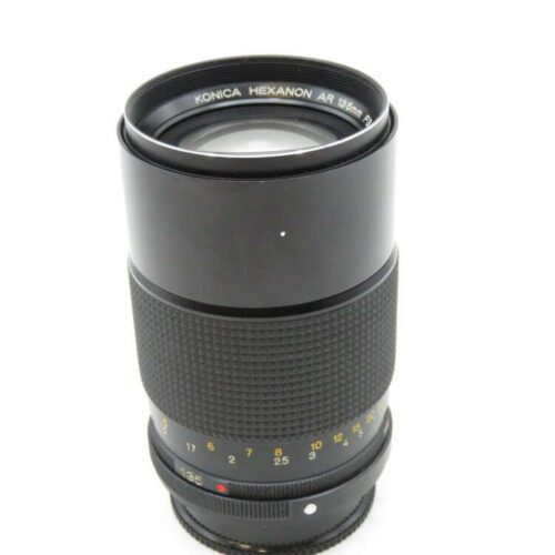 A Konica Hexanon AR camera lens with a 35-100mm focal length displayed against a plain background.