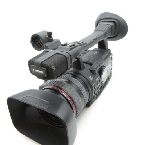 A black Canon video camera with a lens hood, handle grip, and microphone mount.