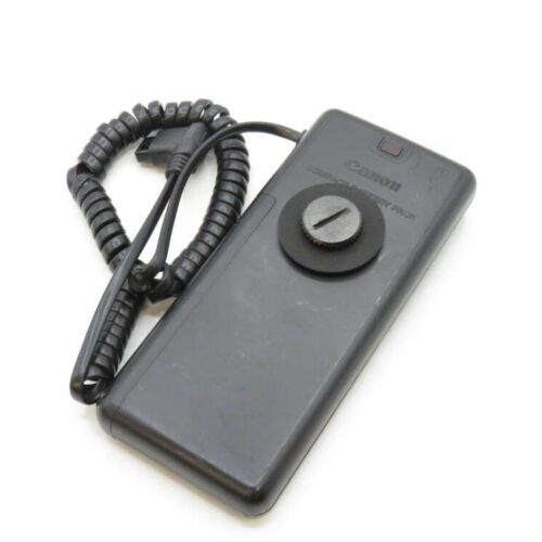 A black Canon Compact Battery Pack with a coiled cord attached.