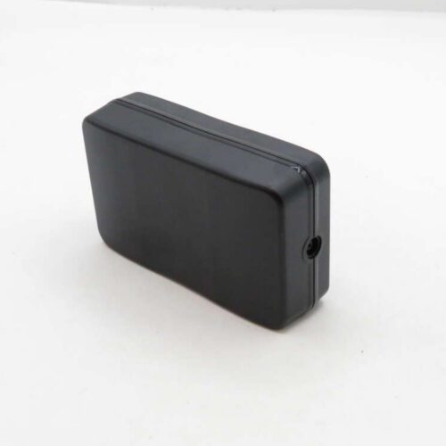 A black rectangular plastic enclosure with a small hole on one side, set against a plain white background.