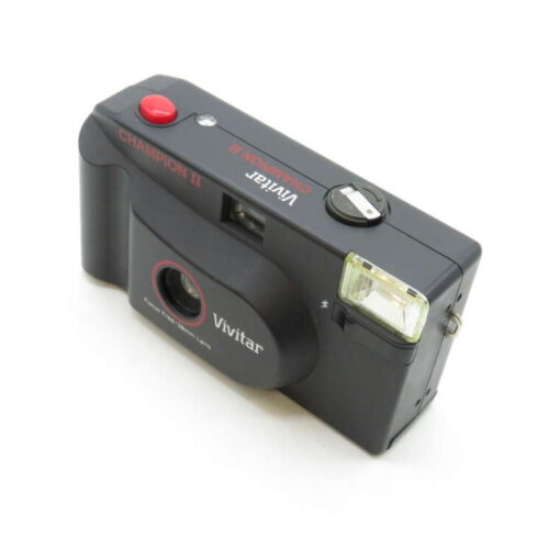 Black Vivitar Champion II film camera with a flash and red shutter button.
