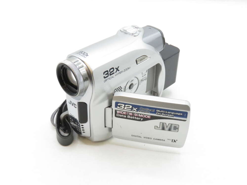 IMG_3395 Silver JVC digital video camera with a 32x optical zoom lens and "32x Optical Hyper Zoom" text on the side.