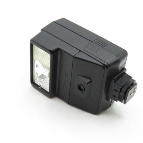 A black camera flash unit with a rectangular flash panel and mounting connector.