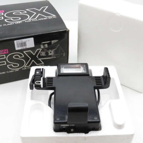 Nissin FSX electronic flash unit for Polaroid SX-70, shown with original packaging and styrofoam casing.