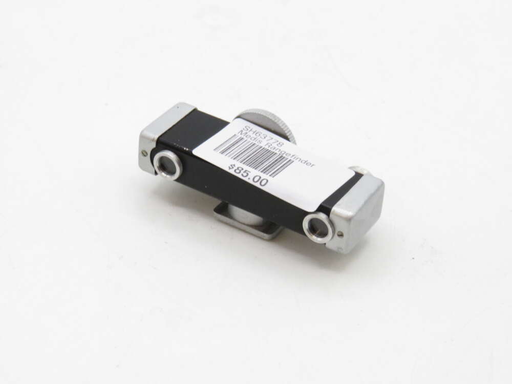 IMG_3539 A small black and silver device with a price label stating "$85.00" and a barcode, set on a plain white background.
