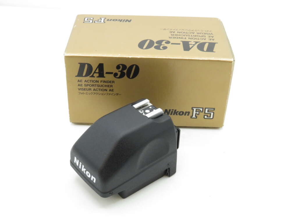 IMG_3582 A Nikon DA-30 AE action finder next to its beige box marked "Nikon F5".