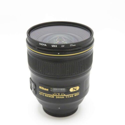 A Nikon AF-S NIKKOR 24mm 1:1.4G ED camera lens with a Hoya 77mm UV filter attached.