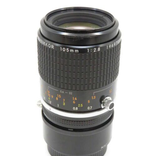 A Nikon 105mm f/2.8 lens with distance markings and focusing ring visible.