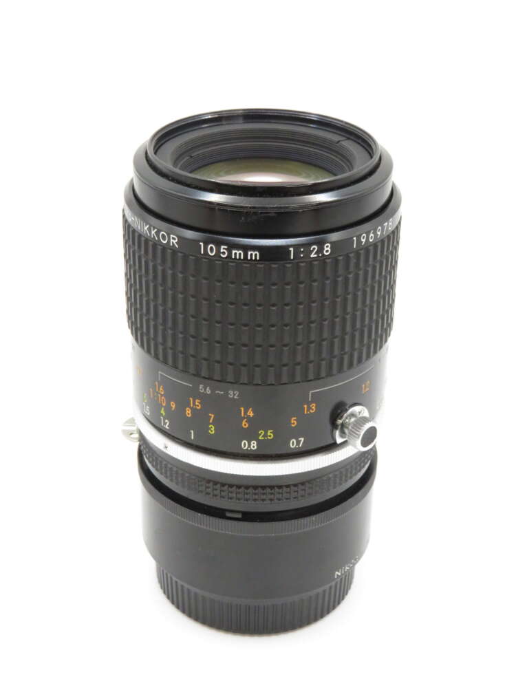 IMG_3615 A Nikon 105mm f/2.8 lens with distance markings and focusing ring visible.