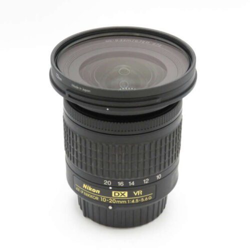 A Nikon DX VR 10-20mm camera lens with detailed markings on a white background.