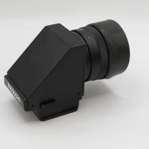 A black Nikon camera viewfinder with a rectangular body and a cylindrical attachment, set against a plain background.