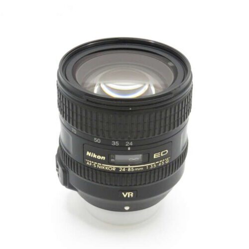 A Nikon AF-S NIKKOR 24-85mm camera lens with VR and ED features, displayed upright against a white background.
