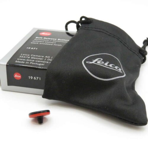 A Leica self-release button with a black pouch and branded packaging.