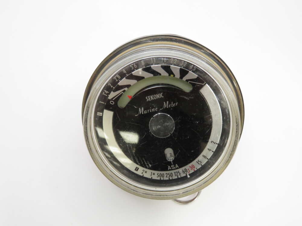IMG_3829 A vintage Sekonic Marine Meter with a round face and measurement markings around the edge.