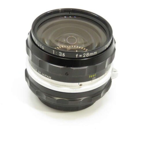 A vintage camera lens with a 28mm focal length and f/3.5 aperture setting, featuring a black and silver design.