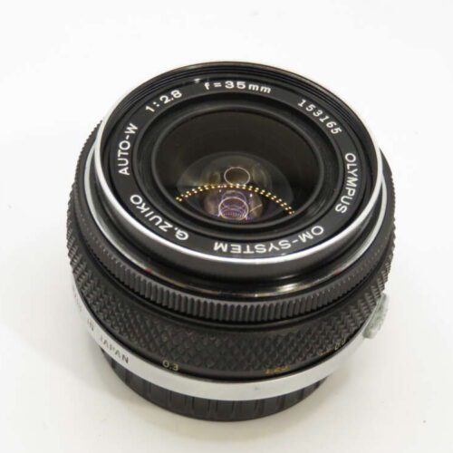 A vintage Olympus camera lens with 35mm focal length and f/2.8 aperture, shown from the front.