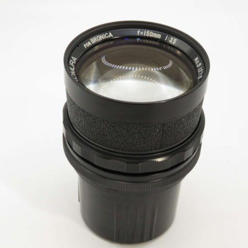A black Zenzanon camera lens marked "150mm f/3.5" with textured focus ring and clean glass.