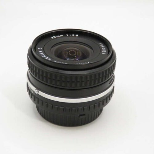 A black camera lens with white text indicating "28mm 1:2.8" and textured grip rings on a plain white background.