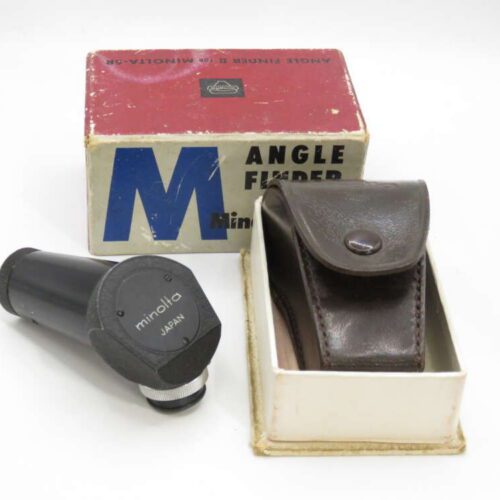 Camera angle finder with Minolta branding next to a brown leather case and a red and white box.