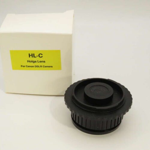 A Holga lens for Canon DSLR cameras next to its yellow-labelled box.
