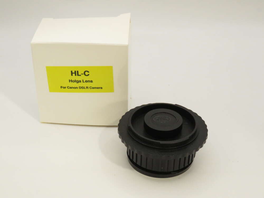 IMG_3935 A Holga lens for Canon DSLR cameras next to its yellow-labelled box.