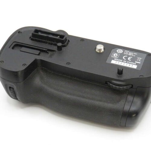 Camera battery grip with rubberised texture, control dials, and a visible label stating "Made in China."