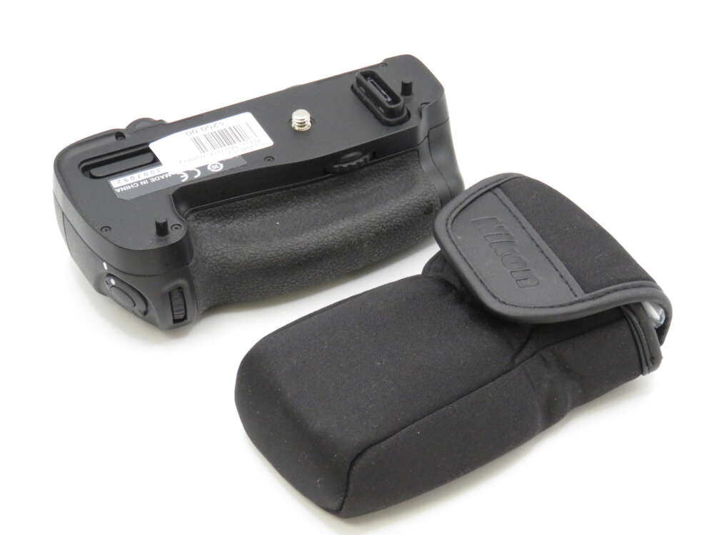 IMG_3960 A camera battery grip and a matching black pouch are shown on a white background.