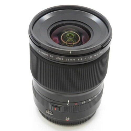 A black Fujinon GF lens with 23mm focal length and detailed markings on the barrel and focus ring.