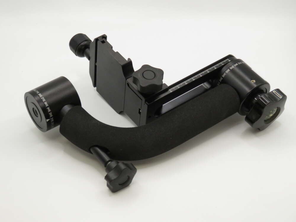 IMG_4025 A black gimbal head with knobs and adjustment scales, designed for stabilising cameras on tripods.